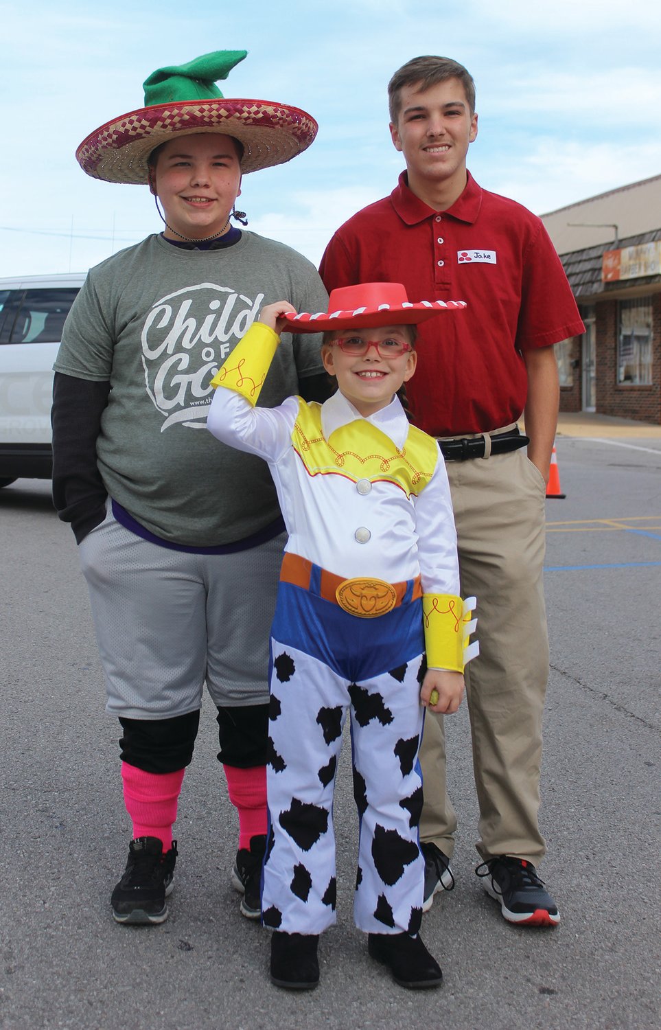 Shown, from left: Josiah Schott (Unique Child of God), Lydia Schott (Jessie from Toy Story) and Isaiah Schott ("Jake" from State Farm) during the Trunk or Treat in Mountain Grove.